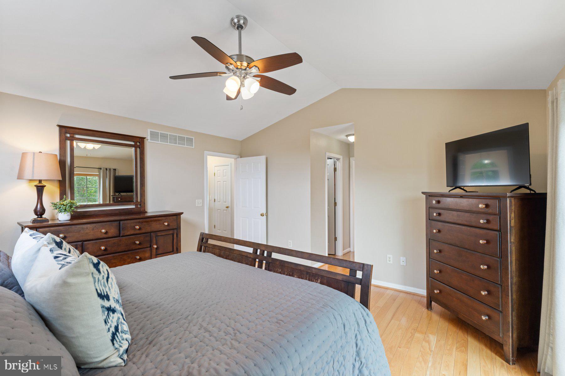 359 Valley Stream Road Severna Park, MD 21146 - Photo 21 of 55 a bedroom with a bed and a flat screen tv