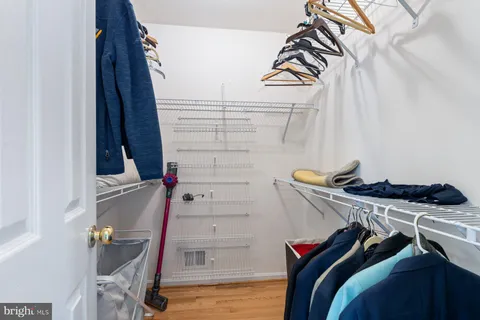 a bedroom with a bed and a painting