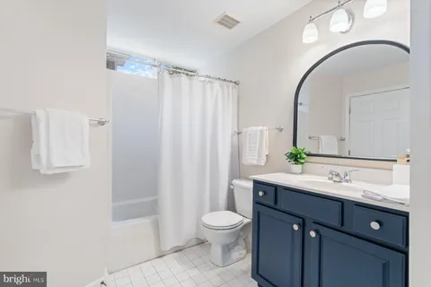 a living room with a couch and a flat screen tv