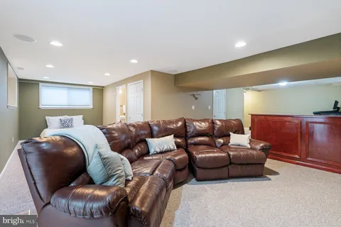 a view of a livingroom with workspace and a window