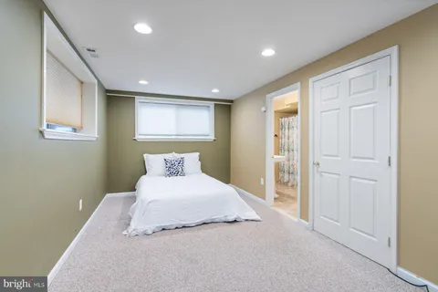 a bathroom with a sink toilet and mirror