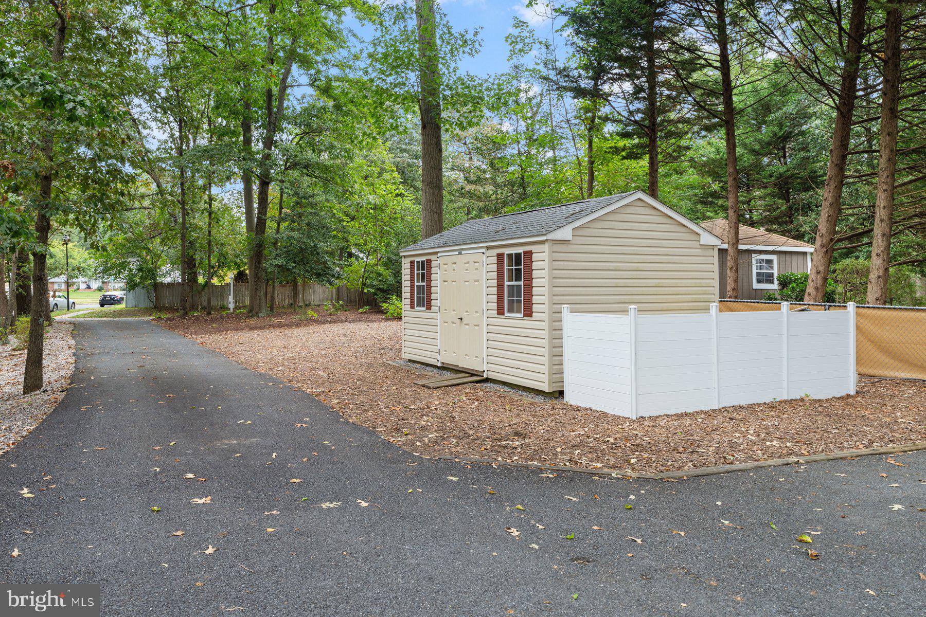 359 Valley Stream Road Severna Park, MD 21146 - Photo 35 of 55 a view of a house with a yard and large trees