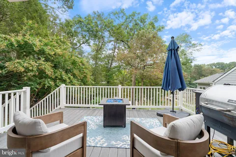 a view of a patio with table and chairs and potted plants