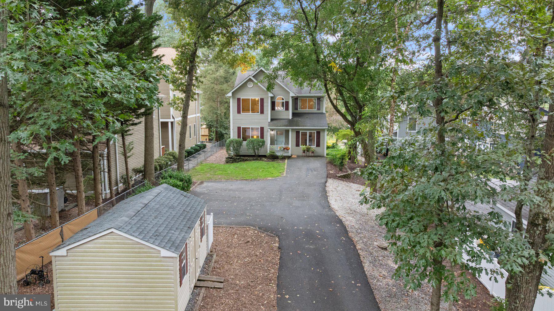 359 Valley Stream Road Severna Park, MD 21146 - Photo 4 of 55 a front view of a house with a yard and trees