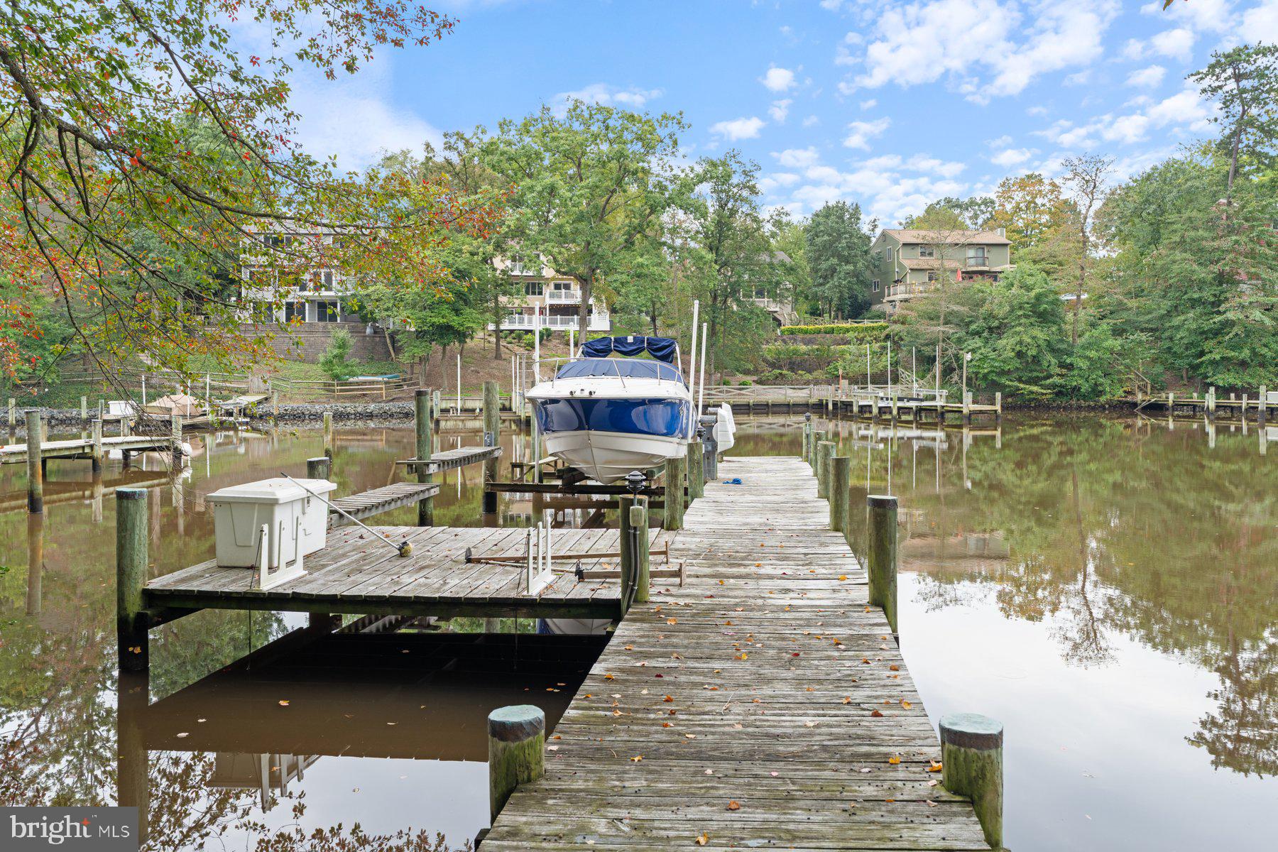359 Valley Stream Road Severna Park, MD 21146 - Photo 48 of 55 a view of a lake with boats and trees in the background