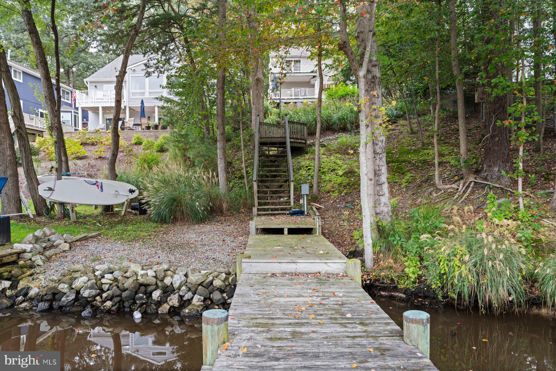 359 Valley Stream Road Severna Park, MD 21146 - Photo 49 of 55 a view of a pathway with a chair and table in the patio