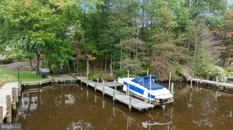 an aerial view of a house with outdoor space and street view