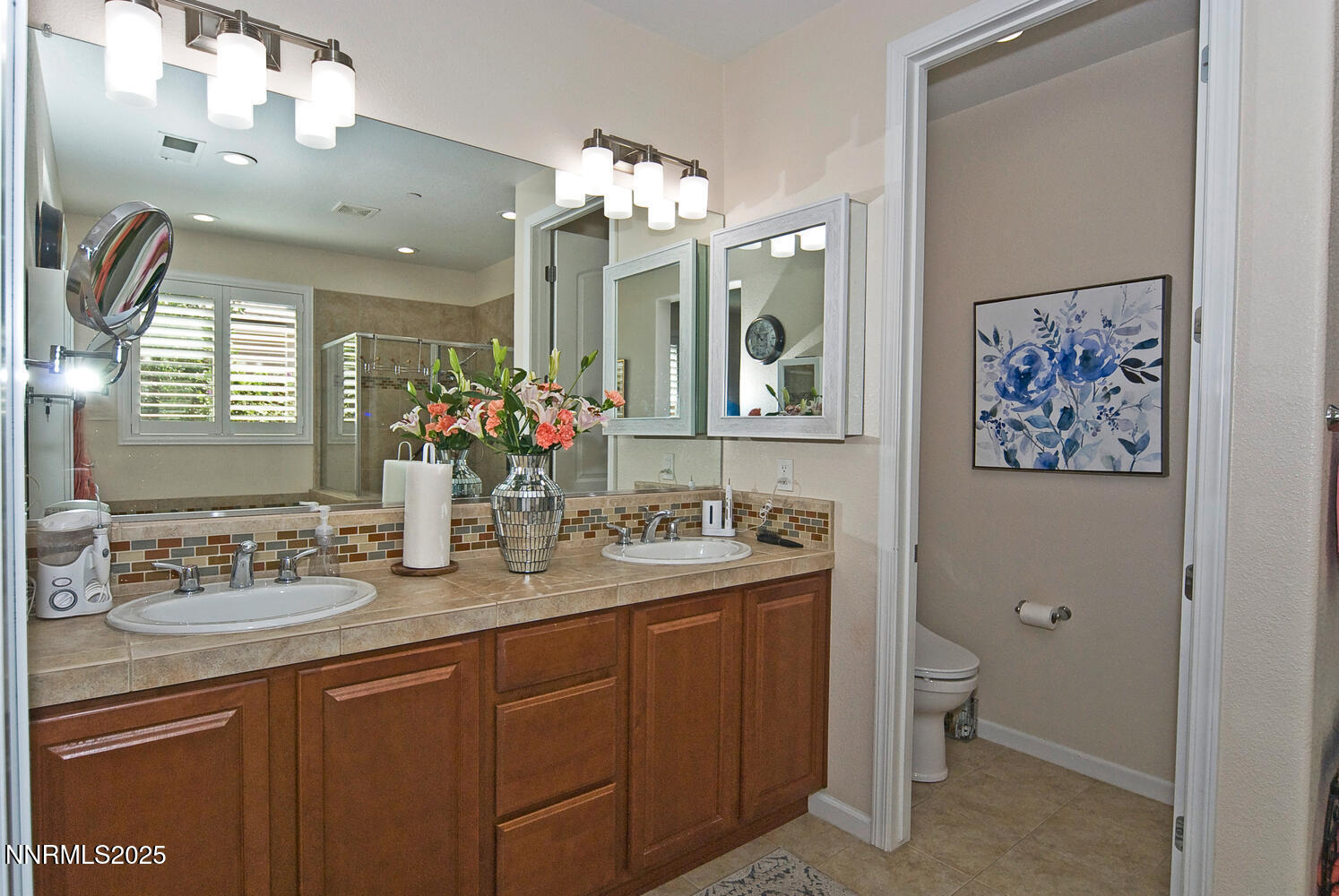 4823 Tree Swallow Lane Sparks, NV 89436 - Photo 11 of 12 a bathroom with a sink double vanity granite and a mirror