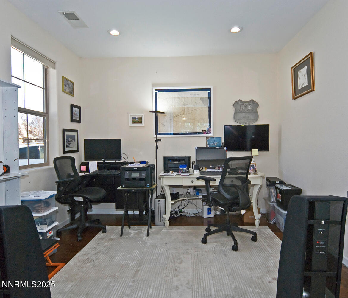 4823 Tree Swallow Lane Sparks, NV 89436 - Photo 8 of 12 a view of a workspace with furniture and a window