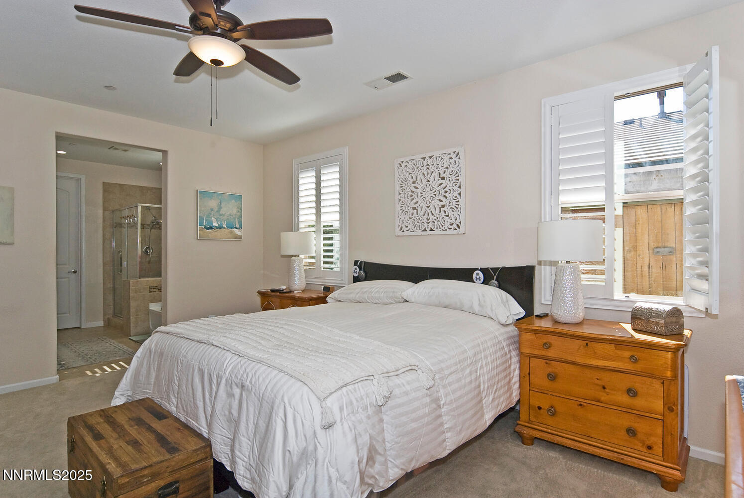 4823 Tree Swallow Lane Sparks, NV 89436 - Photo 9 of 12 a bedroom with a bed and wooden floor