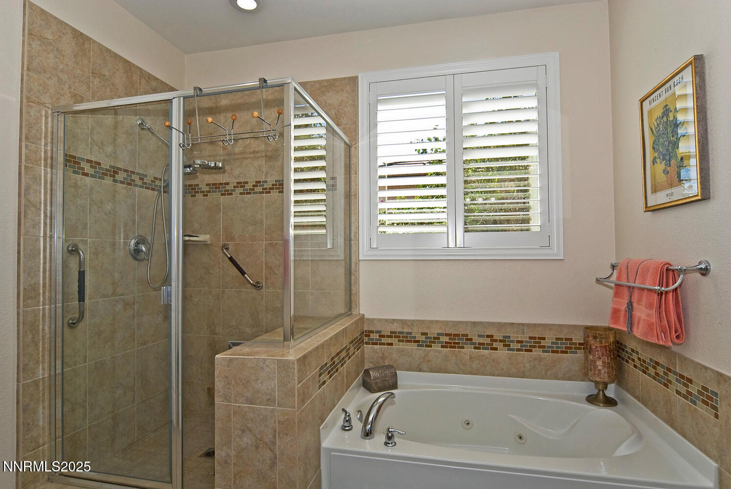 4823 Tree Swallow Lane Sparks, NV 89436 - Photo 10 of 12 a bathroom with a bath tub and a shower