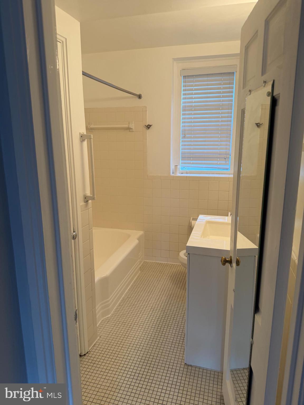 3881 Porter Street Northwest, Unit A295 Washington, DC 20016 - Photo 7 of 15 a bathroom with a bathtub