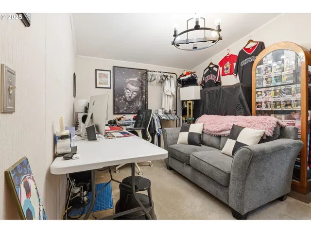 a living room with furniture a flat screen tv and a table