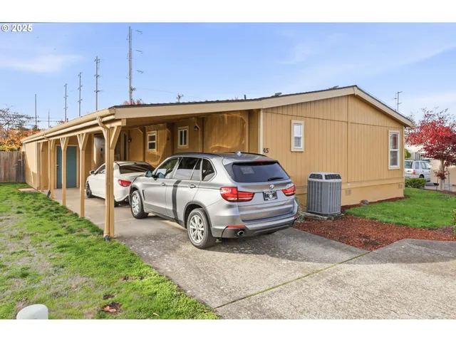 a view of a car in front of a house