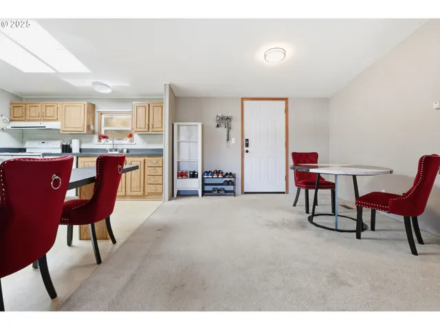 a view of a livingroom with furniture and a chair