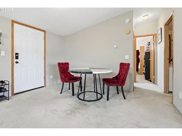 a balcony with a table and chairs