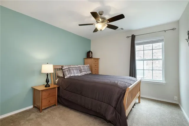 a bed room with a bed and a window