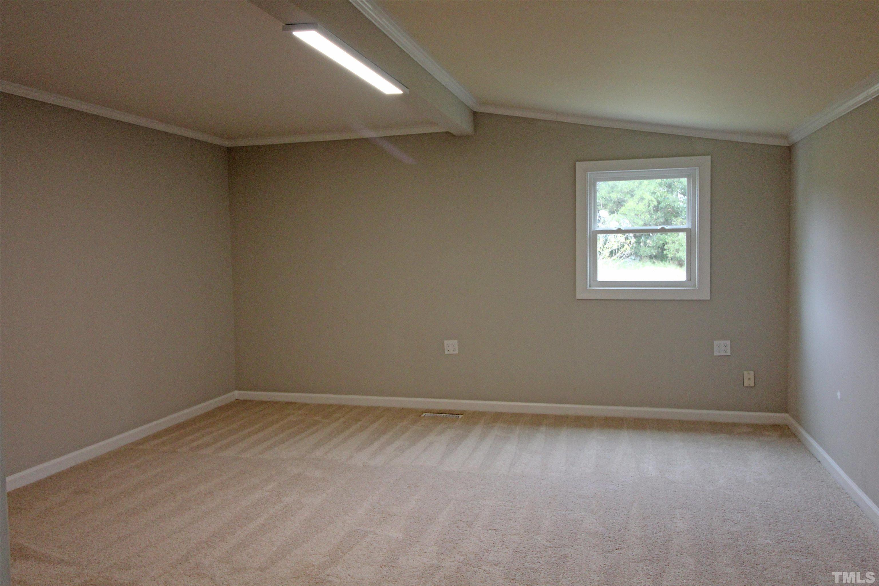 3202 Old Stage Road North Coats, NC 27521 - Photo 15 of 20 an empty room with a window