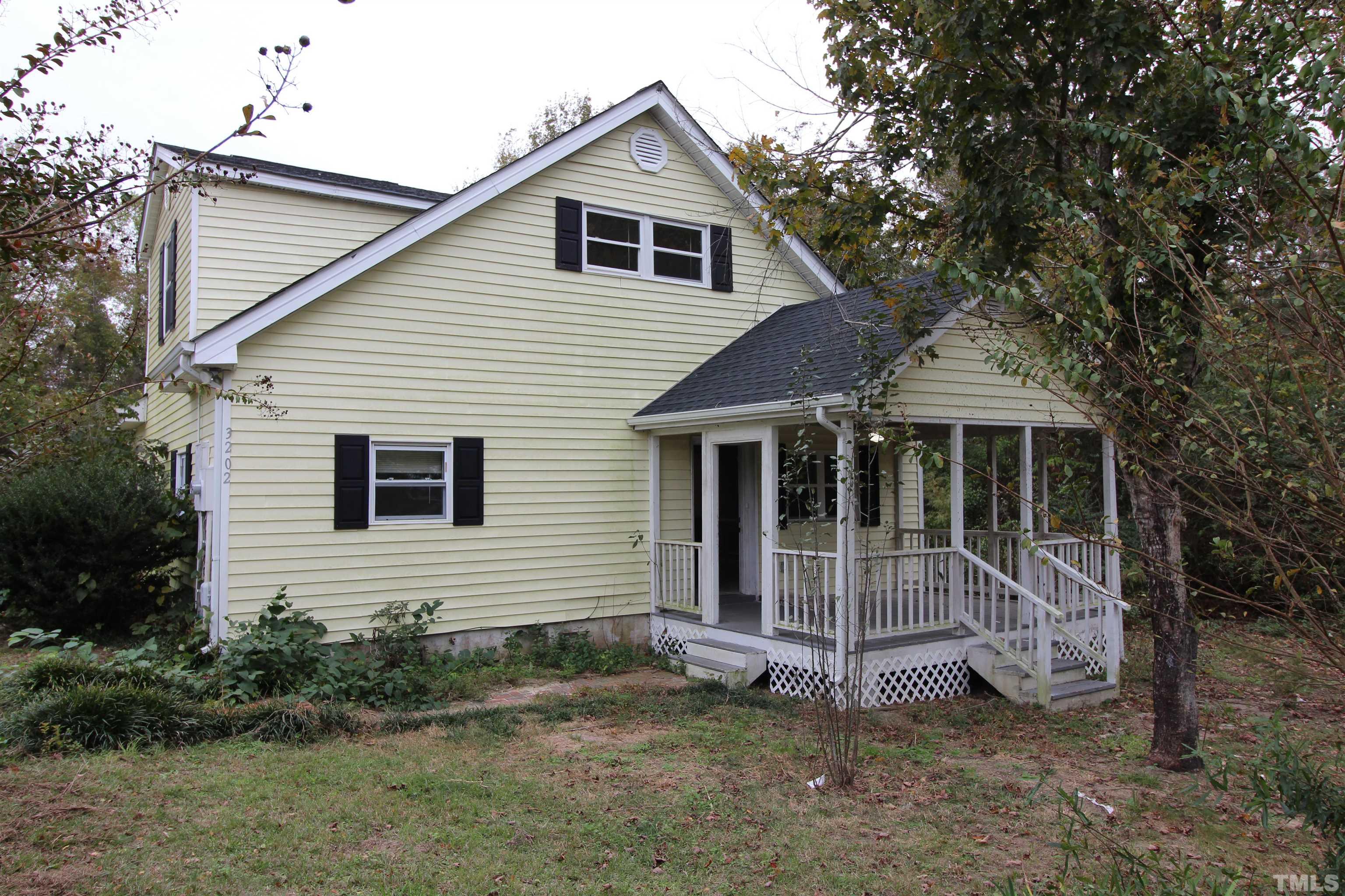 3202 Old Stage Road North Coats, NC 27521 - Photo 3 of 20 a view of a house with a yard