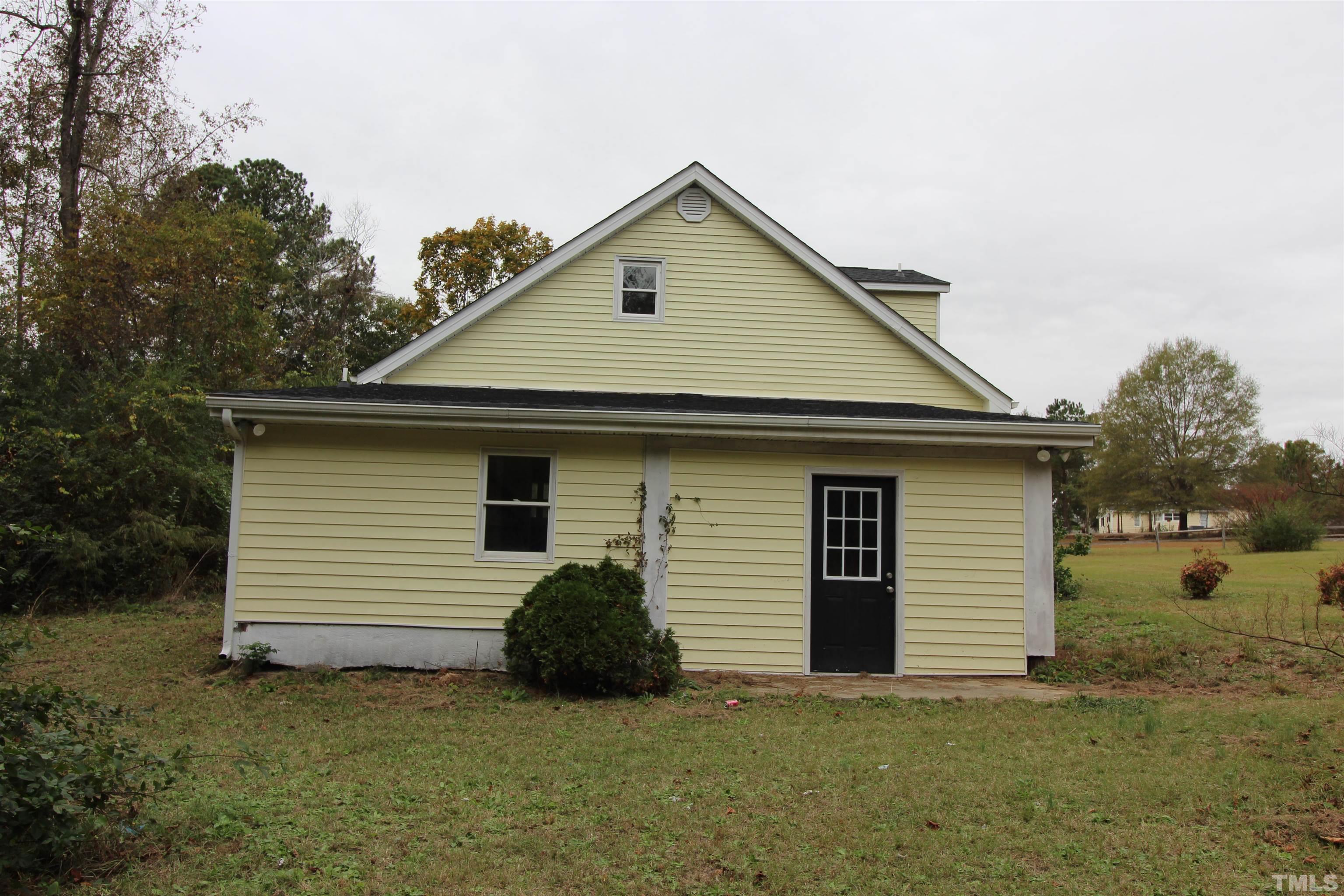 3202 Old Stage Road North Coats, NC 27521 - Photo 4 of 20 a front view of a house with a yard