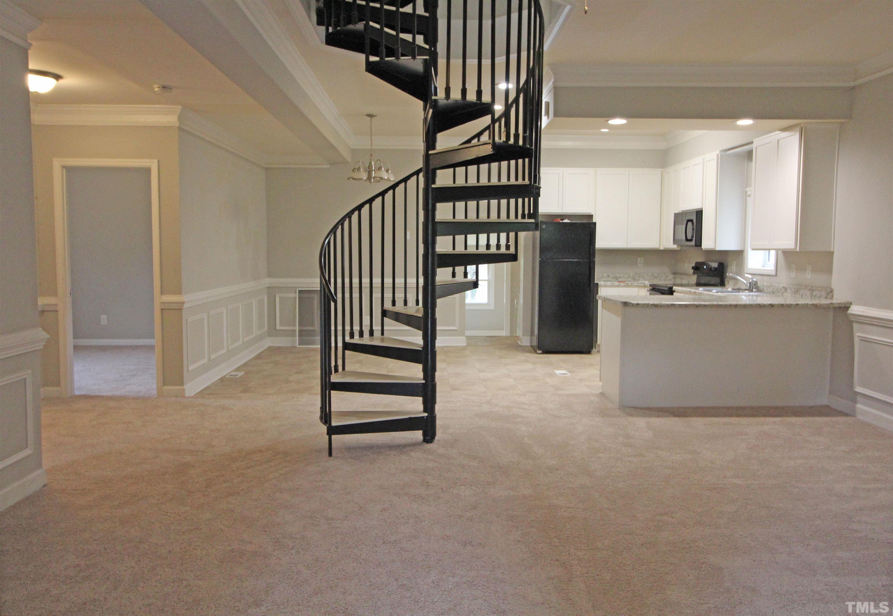 3202 Old Stage Road North Coats, NC 27521 - Photo 6 of 20 a view of a kitchen with furniture and staircase