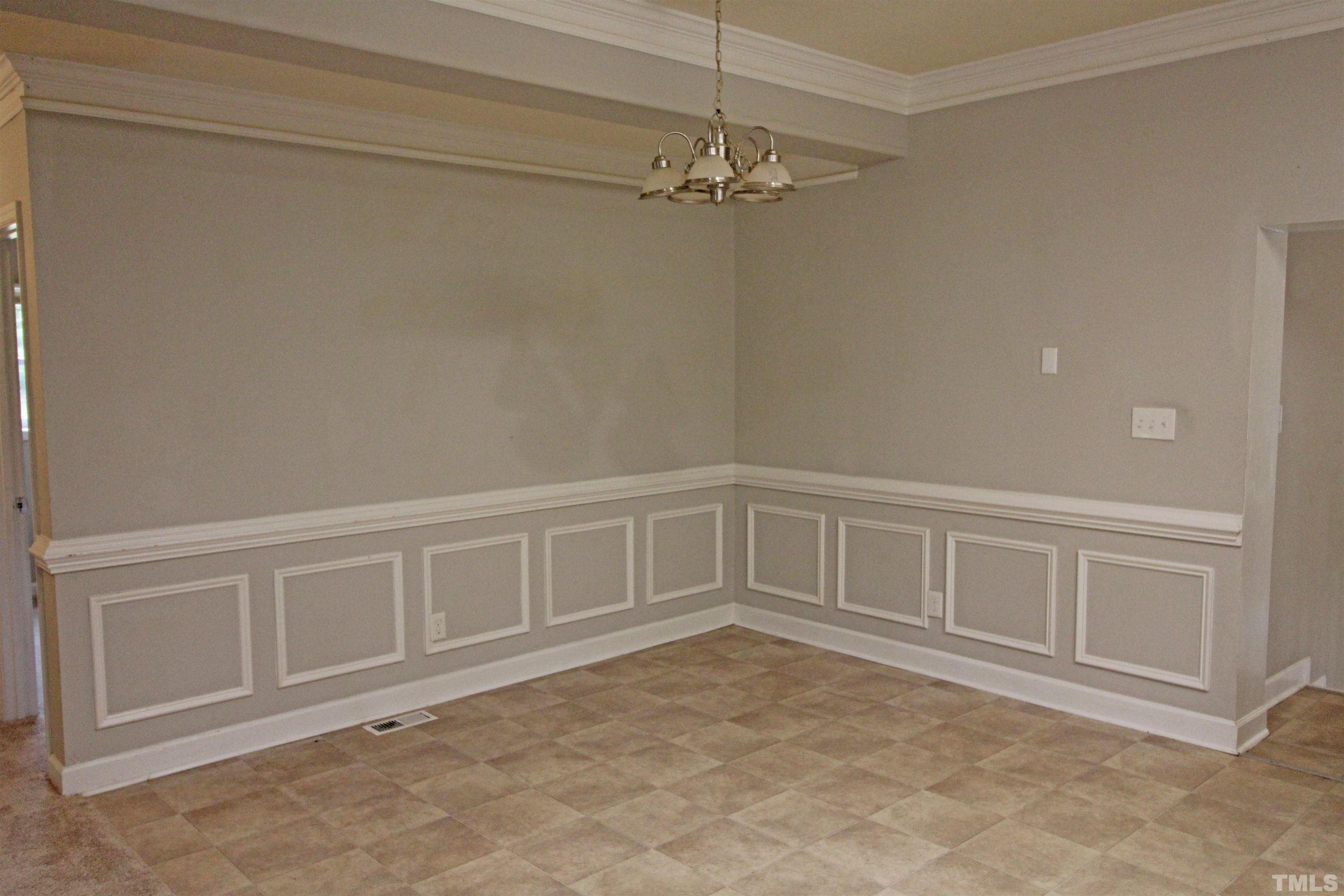 3202 Old Stage Road North Coats, NC 27521 - Photo 8 of 20 a view of an empty room with chandelier fan