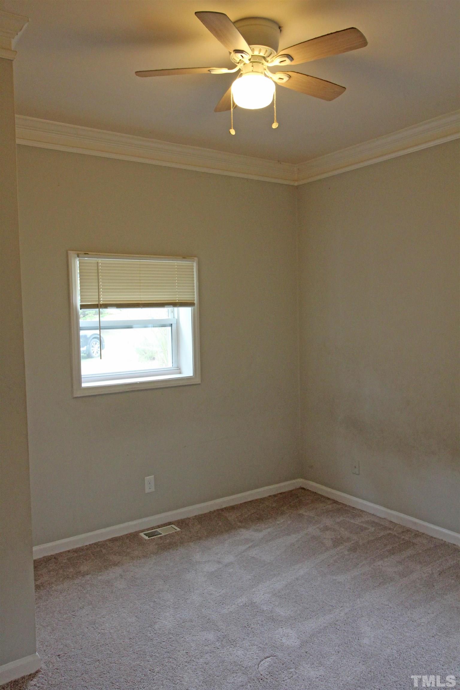 3202 Old Stage Road North Coats, NC 27521 - Photo 10 of 20 an empty room with a window