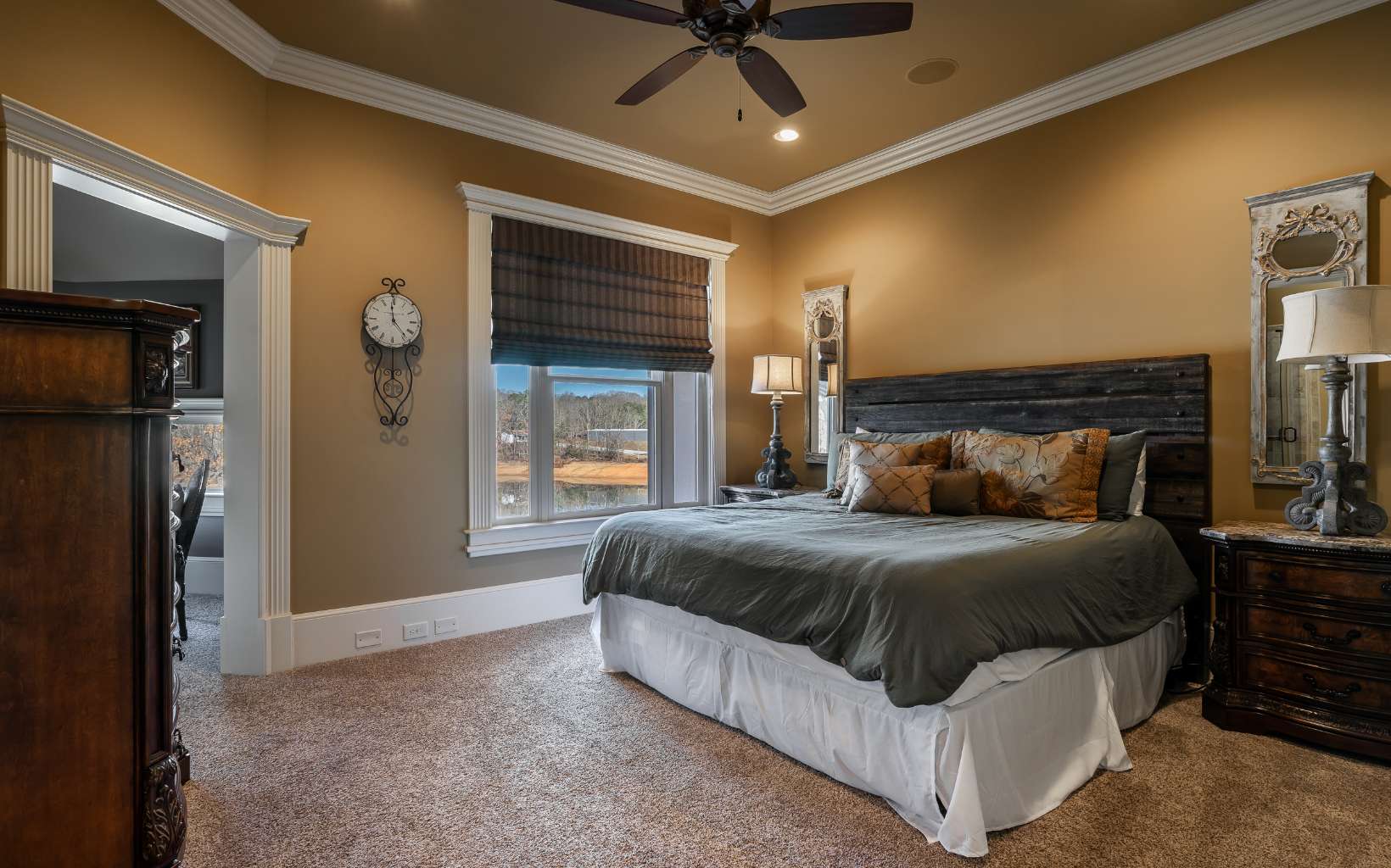 474 Stewart Camp Point Blue Ridge, GA 30513 - Photo 48 of 75 a spacious bedroom with a bed and a chandelier