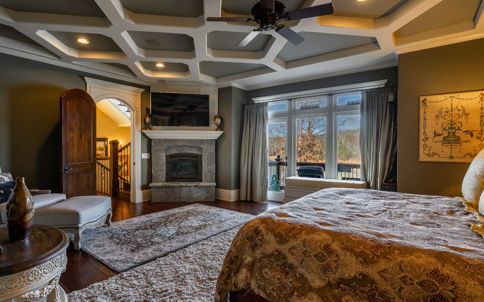 474 Stewart Camp Point Blue Ridge, GA 30513 - Photo 61 of 75 a bedroom with a bed a fireplace and a flat screen tv
