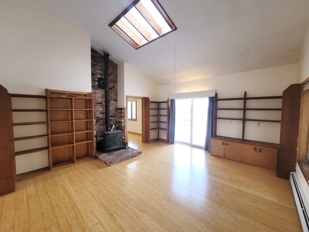 46 Long Hill Road, Unit RIGHT Groton, MA 01450 - Photo 11 of 30 wooden floor in an empty room with a window