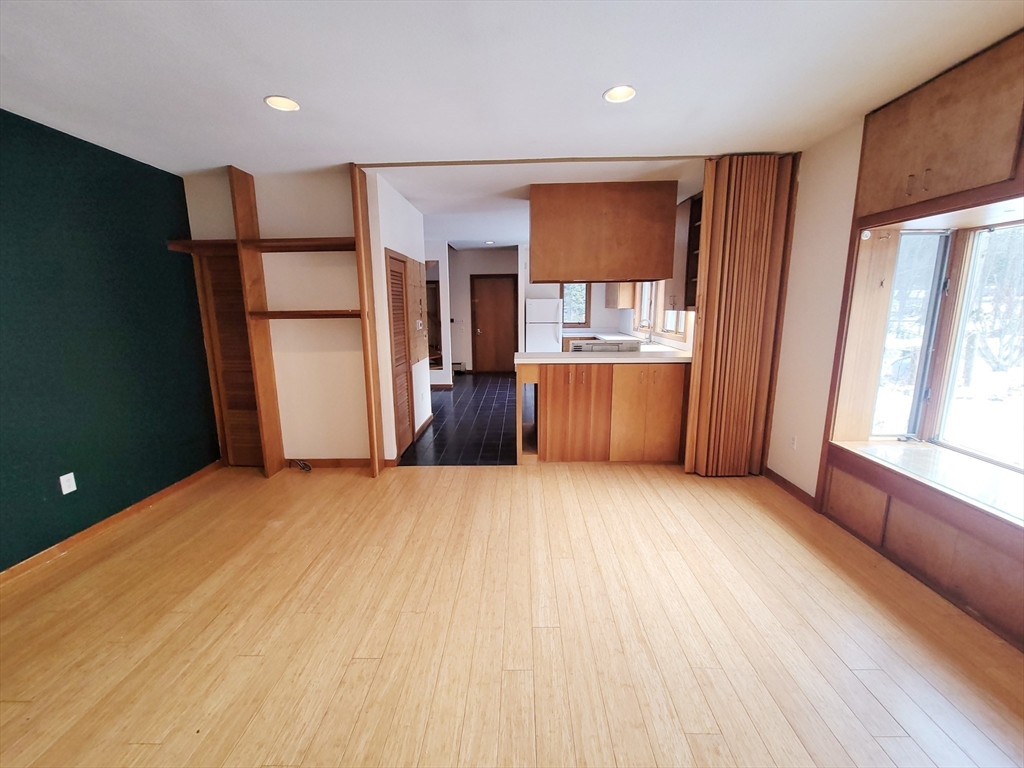 46 Long Hill Road, Unit RIGHT Groton, MA 01450 - Photo 22 of 30 a view of a kitchen with a sink and a refrigerator
