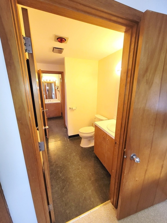 46 Long Hill Road, Unit RIGHT Groton, MA 01450 - Photo 24 of 30 a bathroom with a sink a toilet and a shower