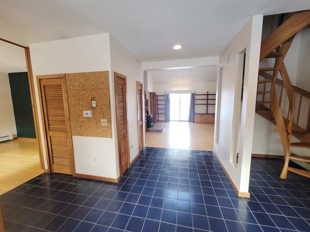 46 Long Hill Road, Unit RIGHT Groton, MA 01450 - Photo 5 of 30 a view of empty room with wooden floor and windows