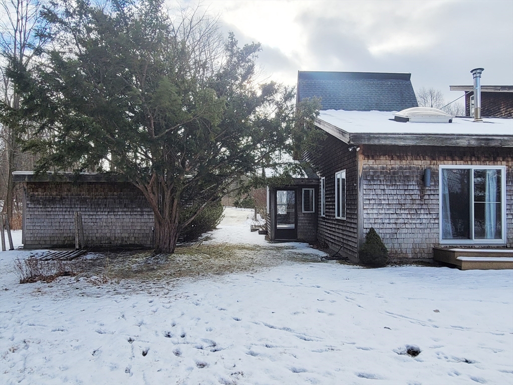 46 Long Hill Road, Unit RIGHT Groton, MA 01450 - Photo 7 of 30 a view of a house with a snow on the road