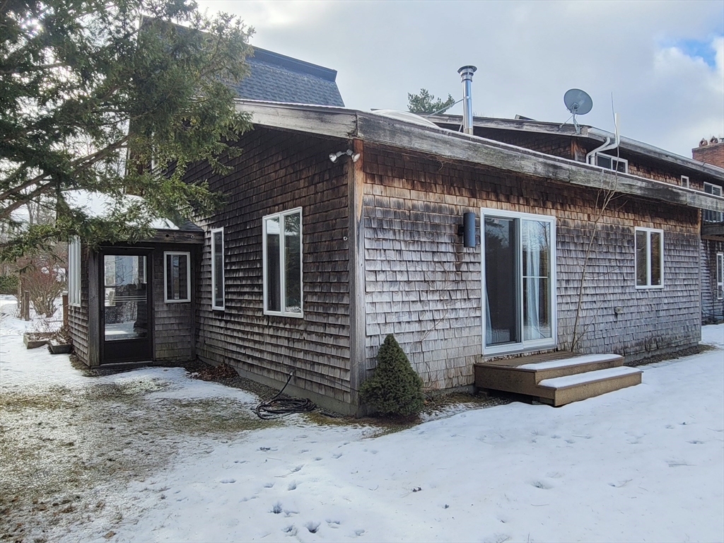 46 Long Hill Road, Unit RIGHT Groton, MA 01450 - Photo 8 of 30 a front view of a house with a garage