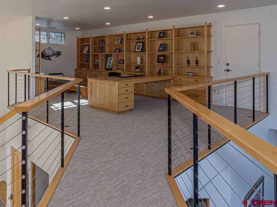 550 Wildcat Trail Hesperus, CO 81326 - Photo 15 of 27 a open kitchen with lots of wooden furniture and a sink