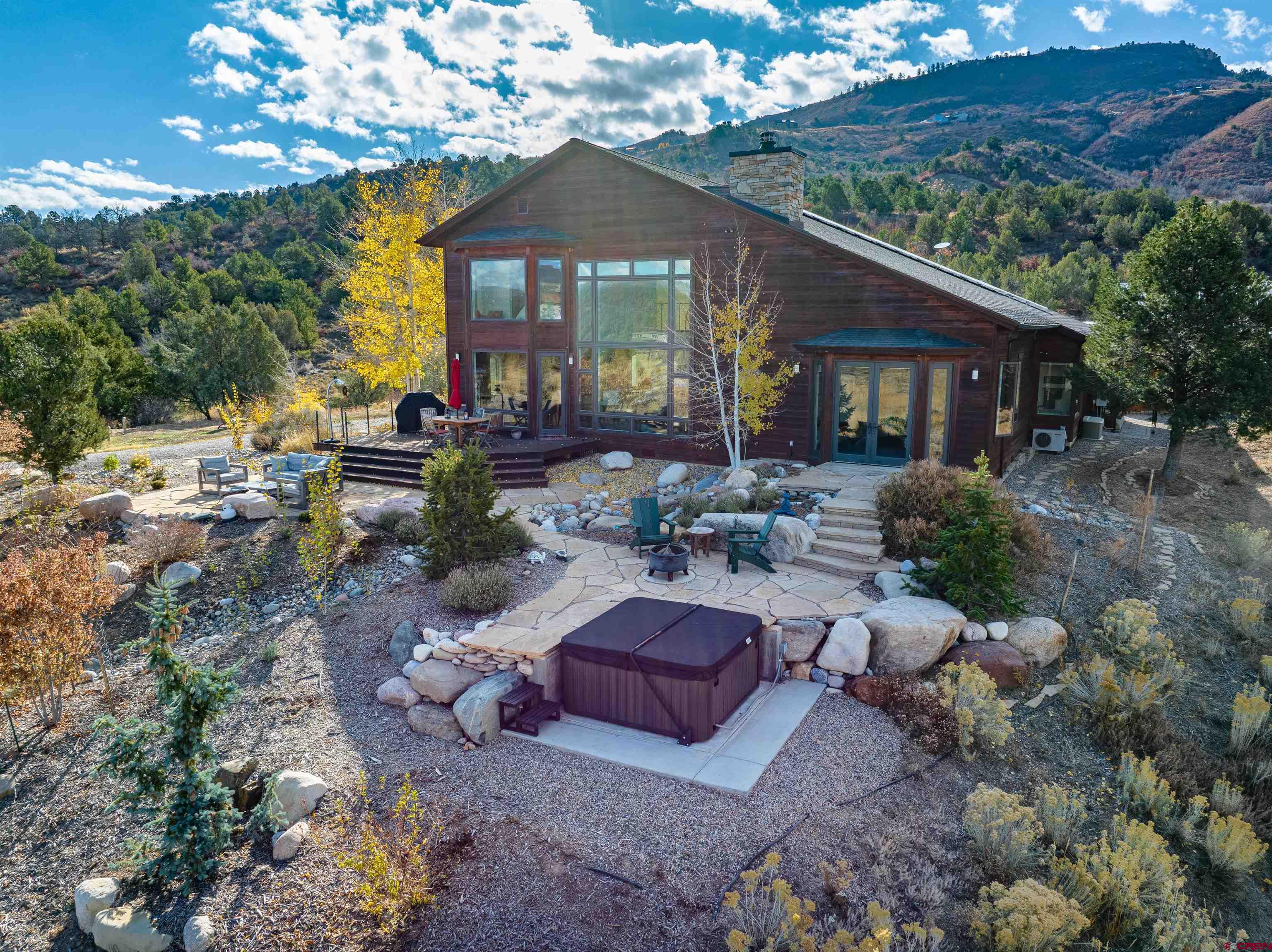 550 Wildcat Trail Hesperus, CO 81326 - Photo 21 of 27 a view of a house with backyard sitting area and garden