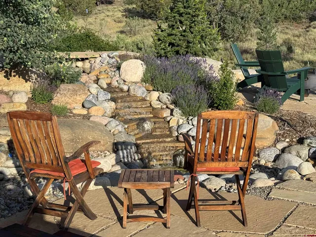 a view of a chairs and table in the patio