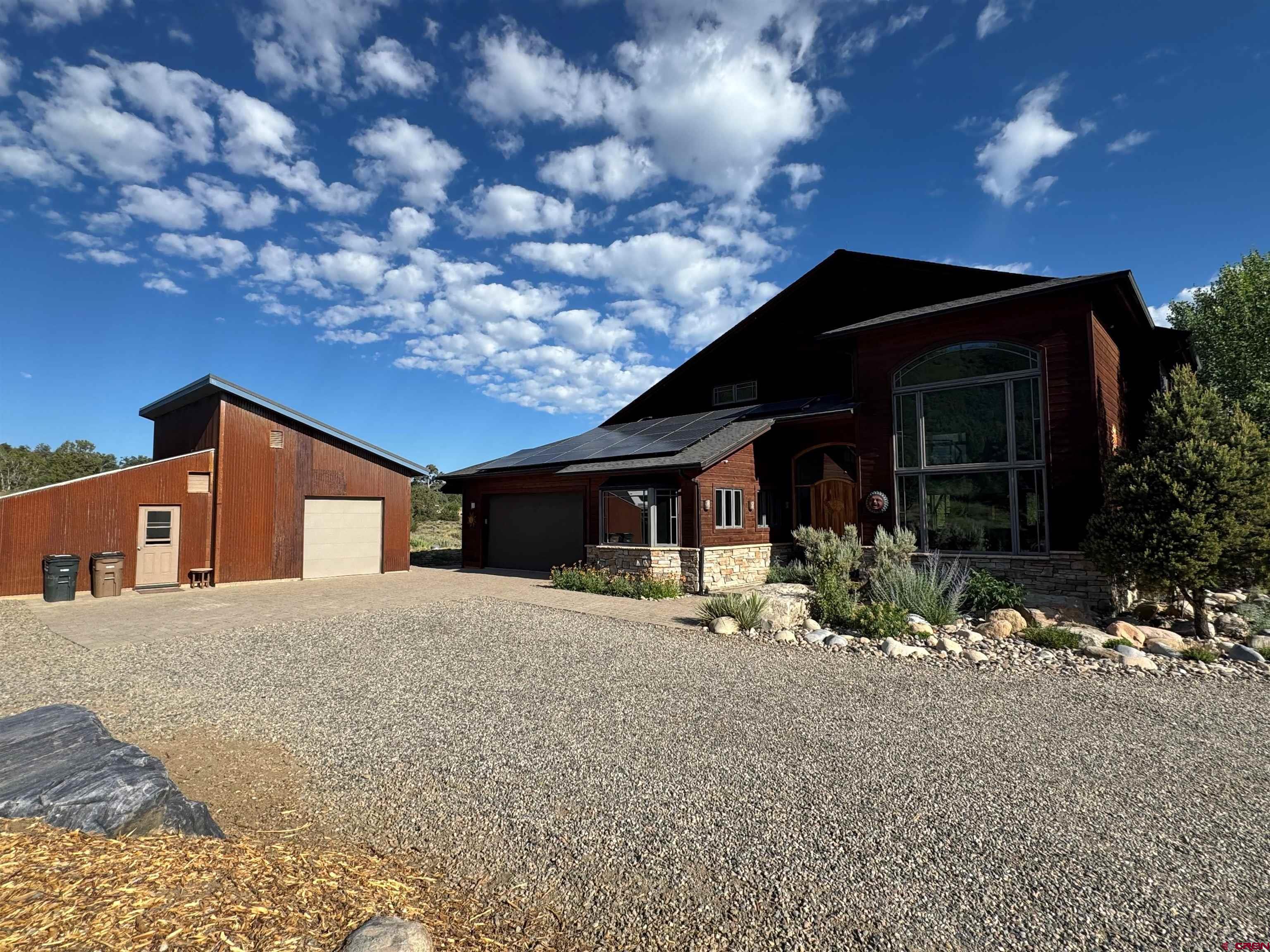 550 Wildcat Trail Hesperus, CO 81326 - Photo 25 of 27 a front view of a house with a yard and garage