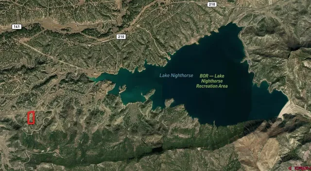 a view of a lake and green space