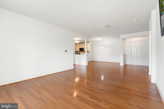 a view of a kitchen with a dishwasher and a refrigerator