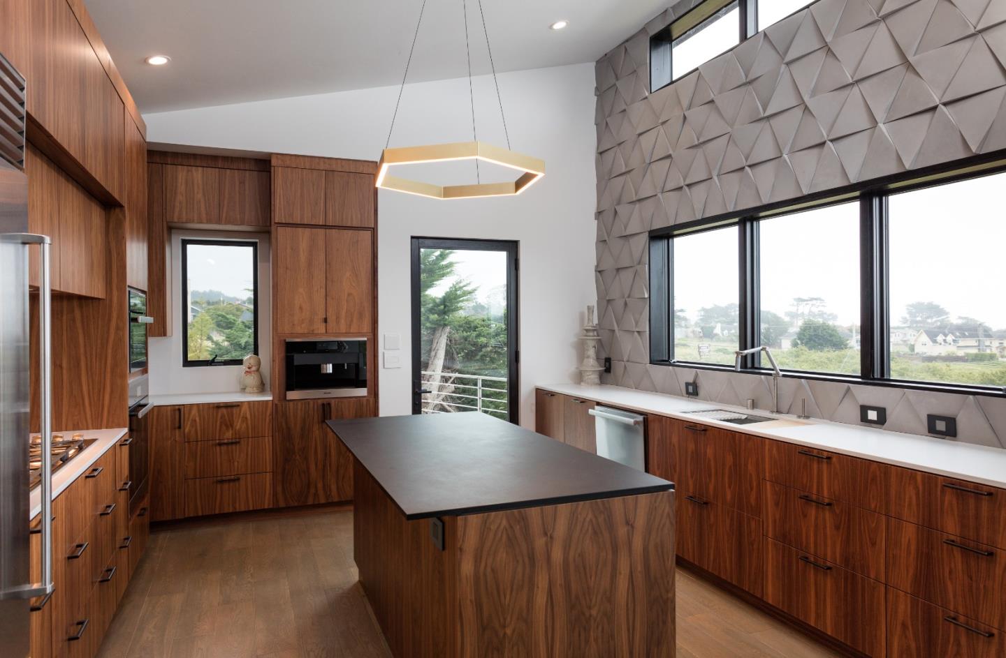 311 Magellan Avenue Half Moon Bay, CA 94019 - Photo 12 of 37 a kitchen with stainless steel appliances granite countertop a sink a stove and a refrigerator