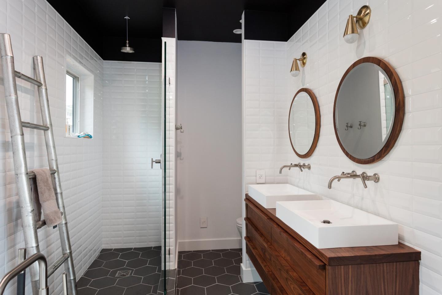311 Magellan Avenue Half Moon Bay, CA 94019 - Photo 19 of 37 a bathroom with a sink vanity granite and a mirror