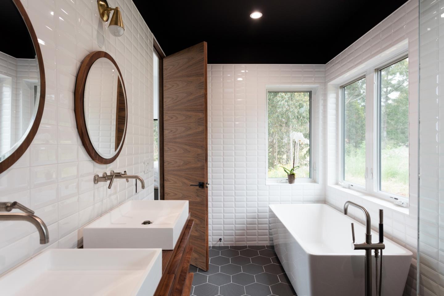 311 Magellan Avenue Half Moon Bay, CA 94019 - Photo 20 of 37 a bathroom with a tub sink and mirror