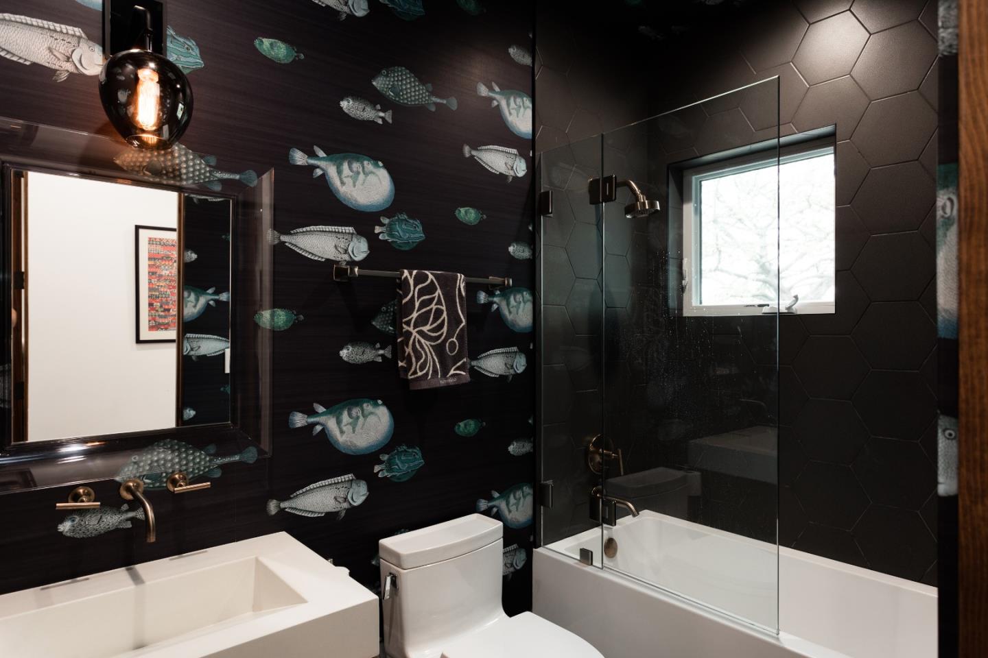 311 Magellan Avenue Half Moon Bay, CA 94019 - Photo 22 of 37 a bathroom with a toilet a sink and mirror