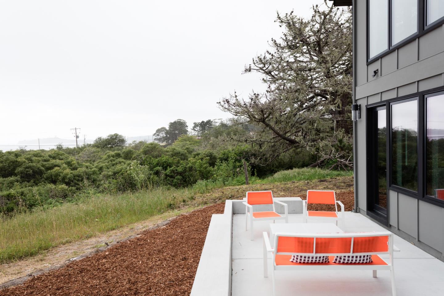 311 Magellan Avenue Half Moon Bay, CA 94019 - Photo 28 of 37 a view of a patio with a table and chairs