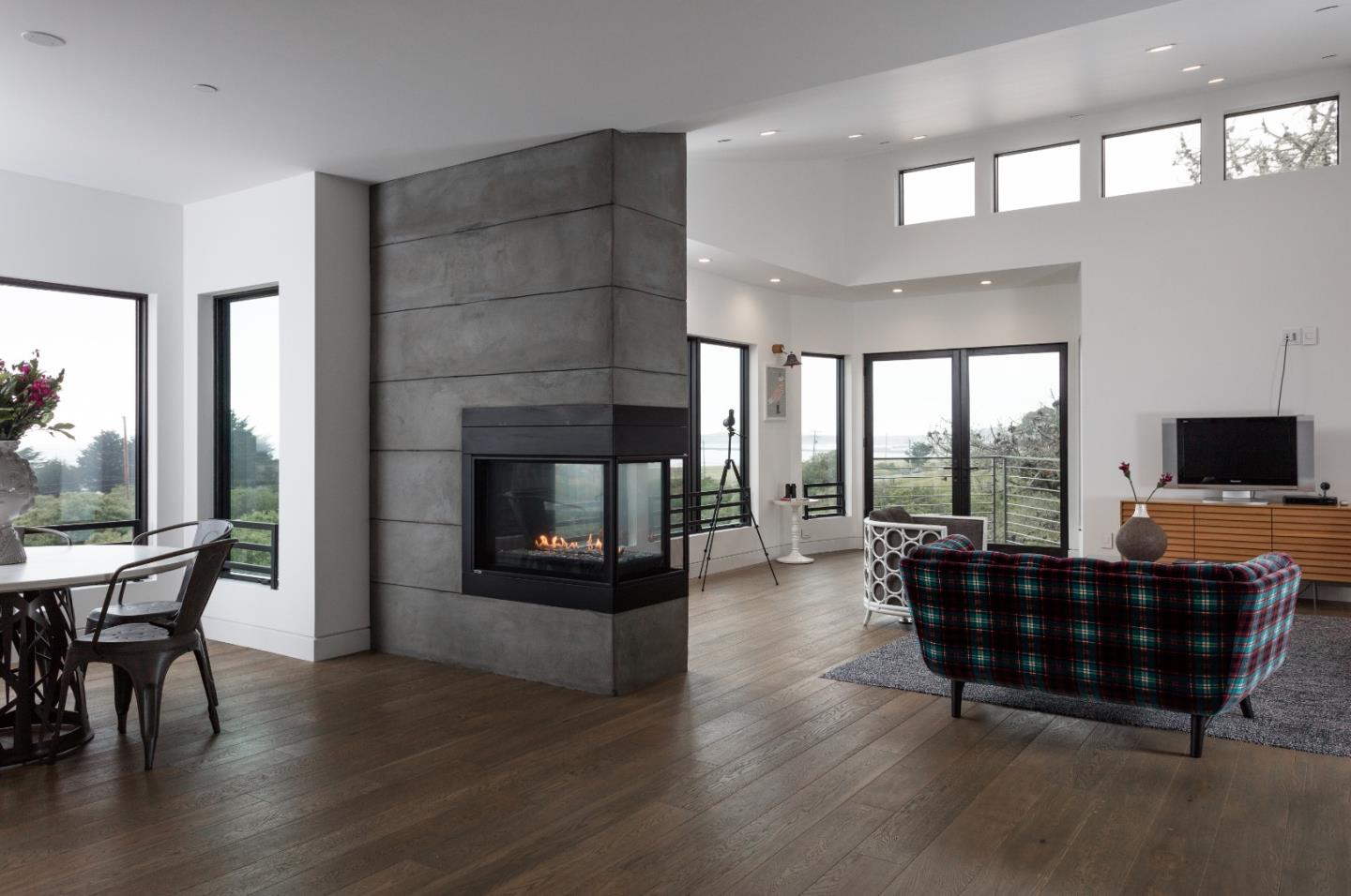 311 Magellan Avenue Half Moon Bay, CA 94019 - Photo 5 of 37 a living room with furniture and a fireplace