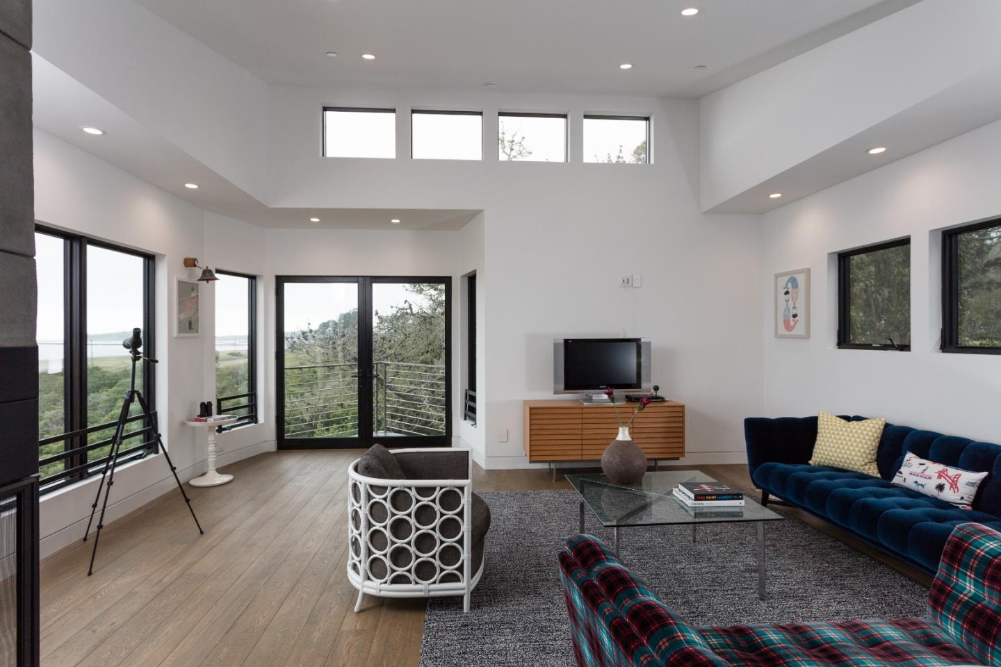 311 Magellan Avenue Half Moon Bay, CA 94019 - Photo 6 of 37 a living room with furniture and a flat screen tv