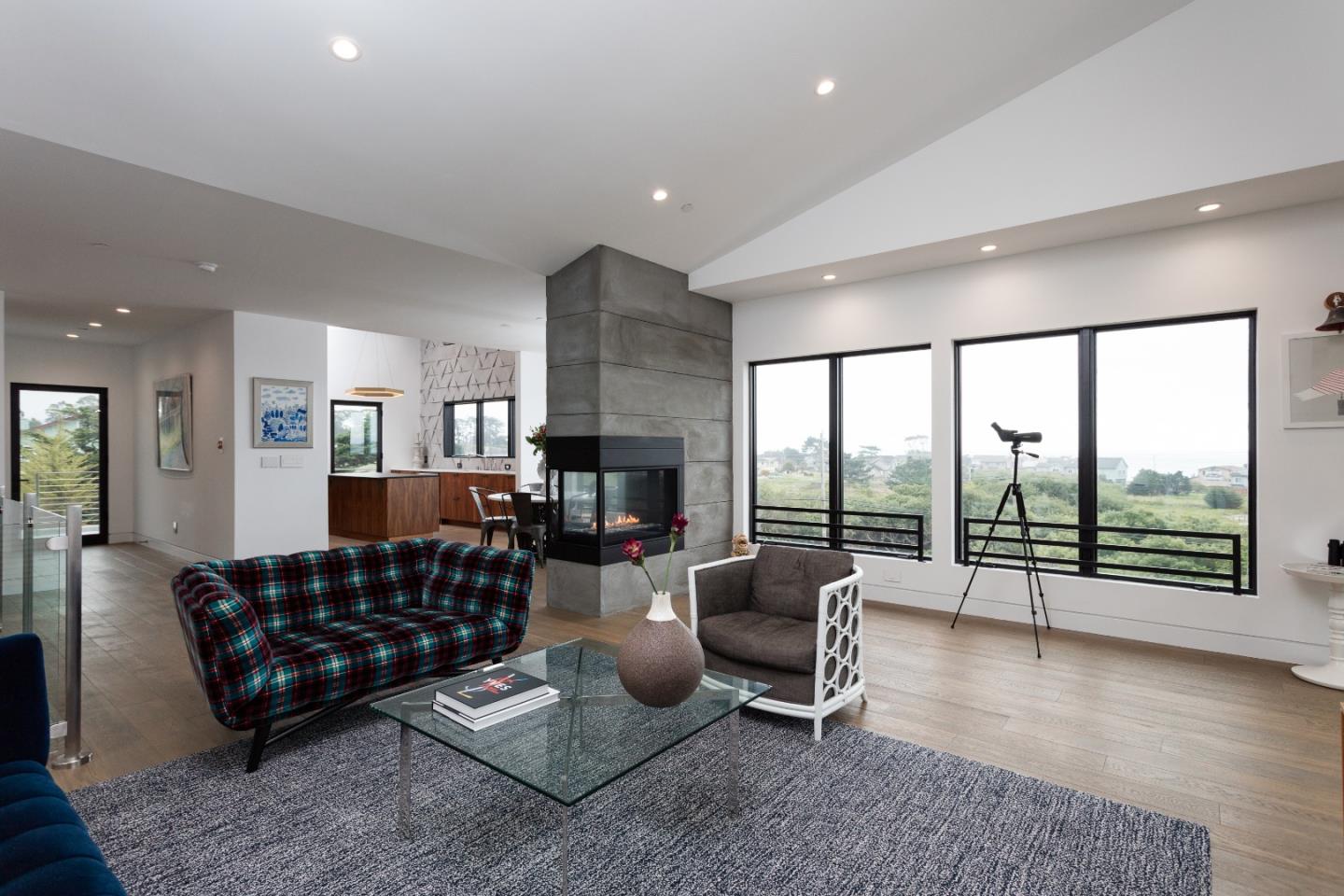 311 Magellan Avenue Half Moon Bay, CA 94019 - Photo 7 of 37 a living room with furniture and a floor to ceiling window
