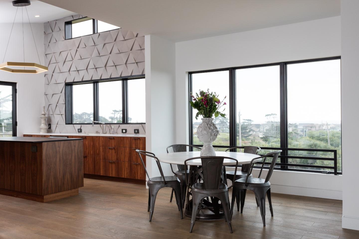 311 Magellan Avenue Half Moon Bay, CA 94019 - Photo 9 of 37 a view of a dining room with furniture window and wooden floor